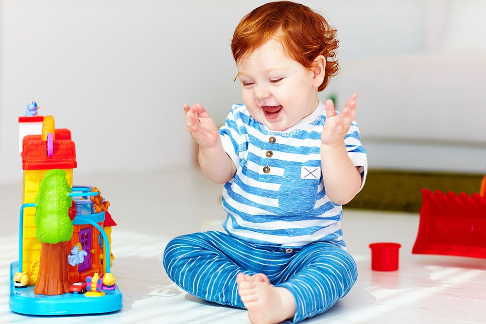 red haired toddler playing